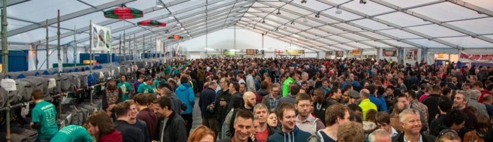 Crowd of drinkers in a beer festival tent