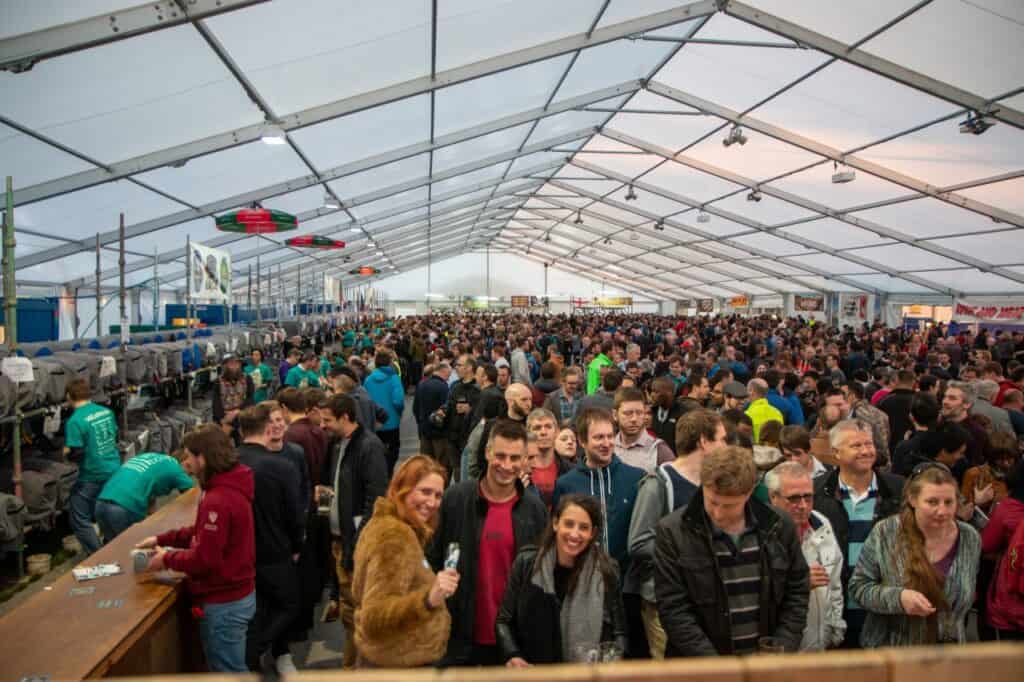 Crowd of drinkers in a beer festival tent